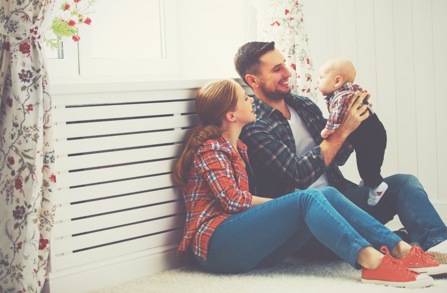 mother and father playing with a baby